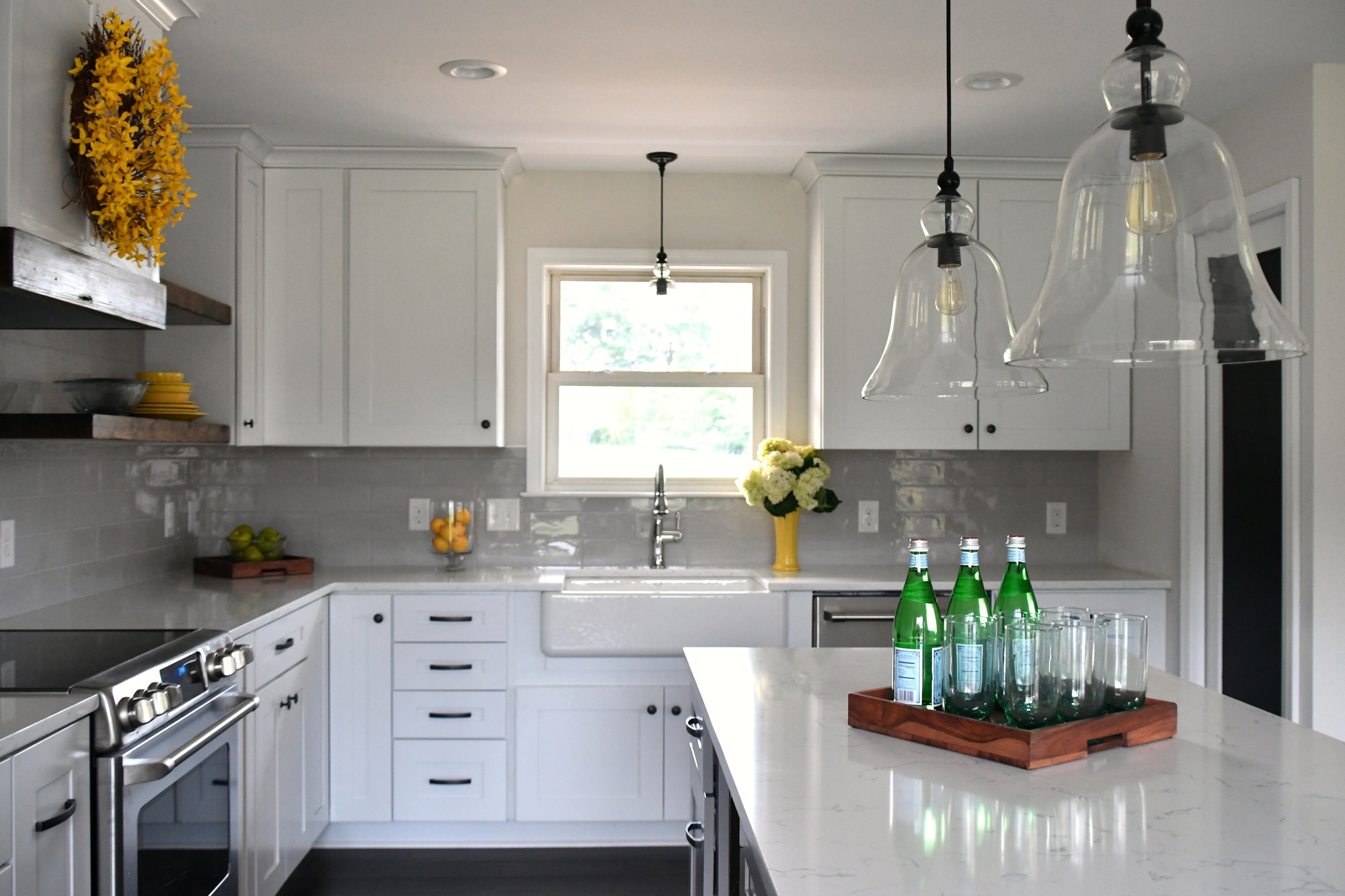 Bright white kitchen in a new home with open concept layout, light and airy lifestyle